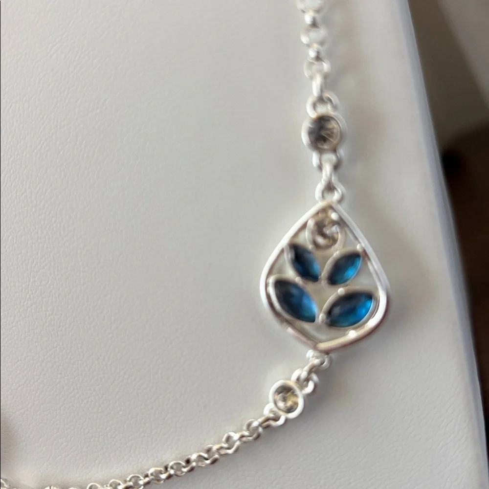 Gloria Vanderbilt Reversible Silvertone chain,teardrop w/blue & clear stones